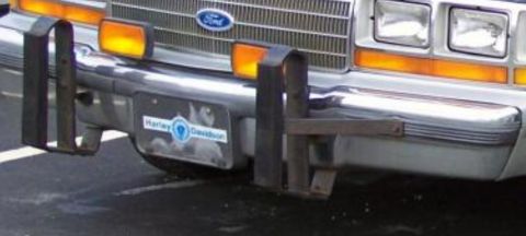 1991 Ford LTD Crown Victoria - Front view of a 1990 Ford Crown Victoria with a chrome bumper and aftermarket push bar.