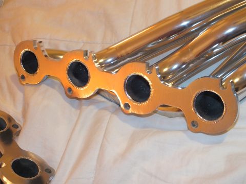 2003 Ford Crown Victoria - Detail of a gold-tone header flange with four sealed ports and polished primary tubes