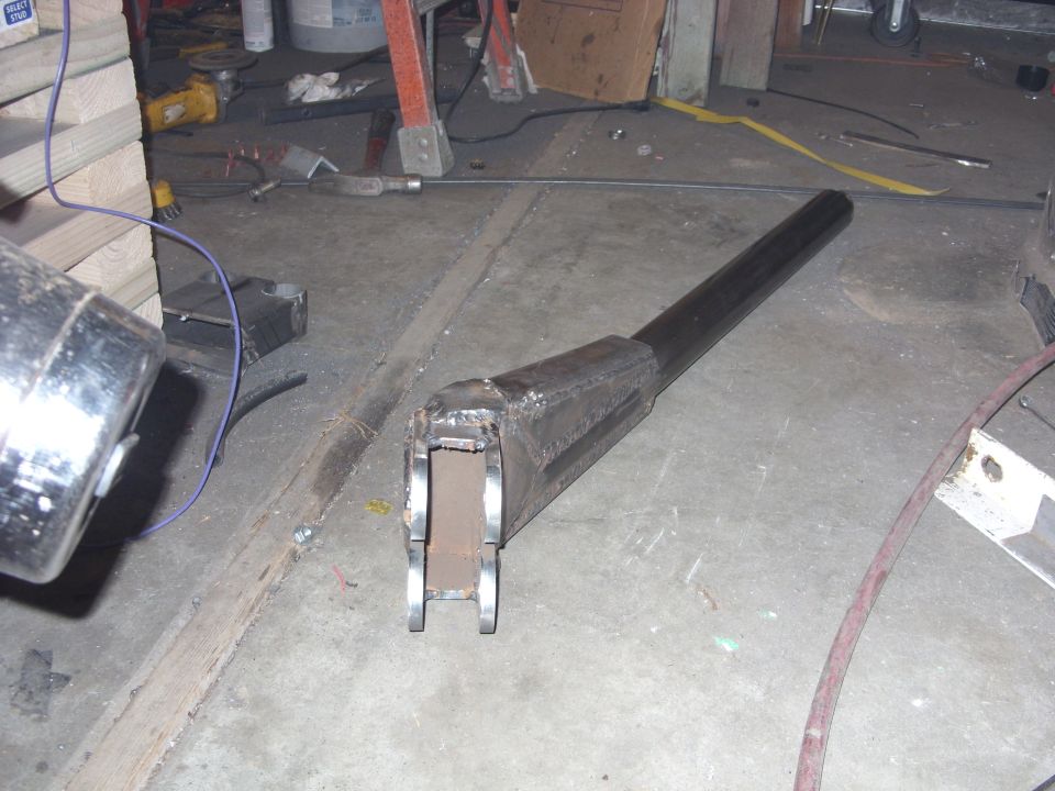 Fabricated metal part with a long cylindrical section and a boxed end