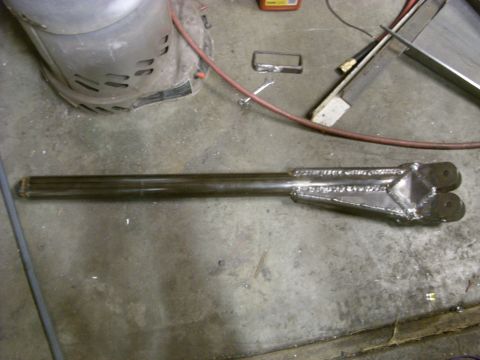 1967 Ford F-250 - Custom fabricated suspension part resting on a workshop floor.