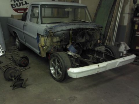 1967 Ford F-100 - This 1967 Ford F-100 pickup is undergoing restoration, with its front end disassembled.