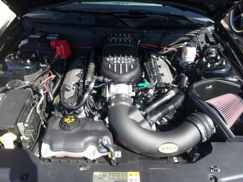 1965 Ford Mustang - Engine bay a BOSS 302 engine cover and AIRAID cold air intake system.