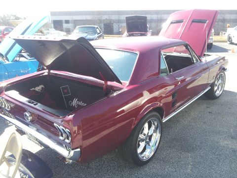 1965 Ford Mustang - Maroon 1967 Ford Mustang fastback with trunk and hood open, custom wheels visible.