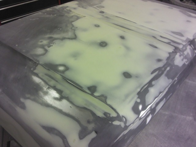 Hood with body filler and primer patches