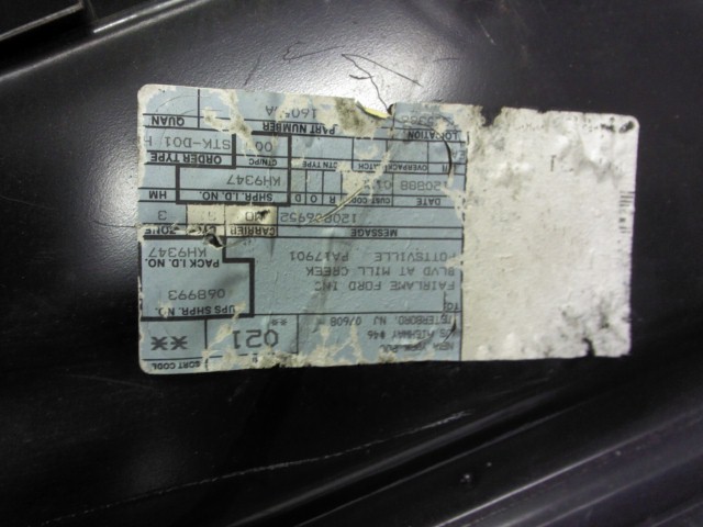 Shipping label on black surface, showing text including 'FAIRLAME FORD INC' and 'OTTEVILLE'