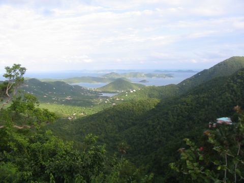 1992 Ford Bronco - A panoramic view captures the beauty of tropical islands dotted with houses, overlooking a calm blue sea.