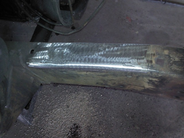 Close-up of a metal frame section with visible welds