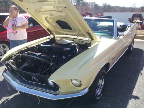 1965 Ford Mustang - Front view of a 1969 Ford Mustang convertible, hood open, revealing the engine.