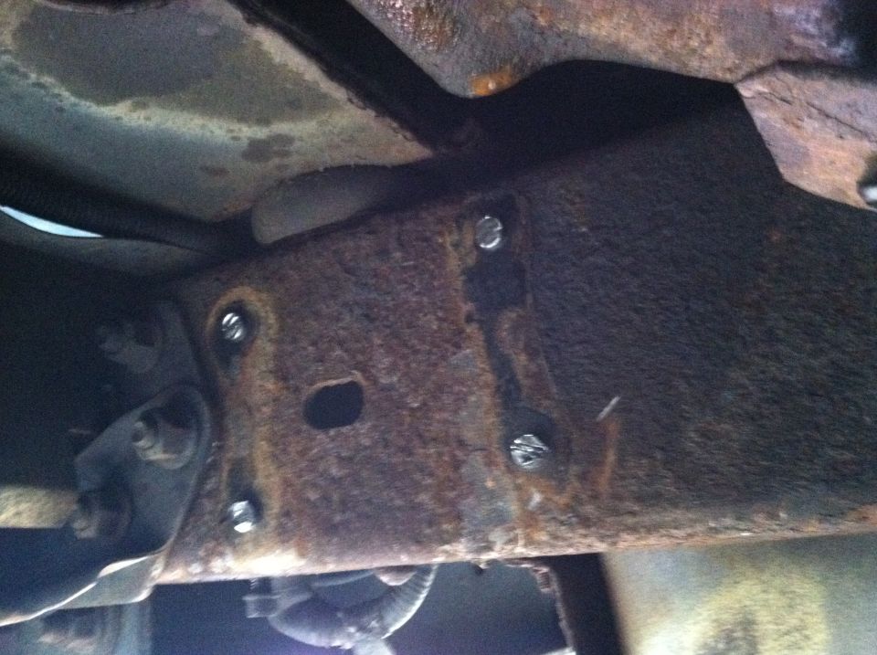 Rusted frame section with bolts