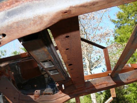 1976 Chevrolet Corvette - The frame of a vehicle, heavily rusted, is shown with a Supermotors.net logo visible in the lower right corner.