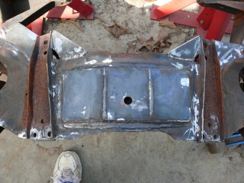 1976 Chevrolet Corvette - This is a welded metal frame part, possibly from a vehicle chassis. A shoe is visible for scale.