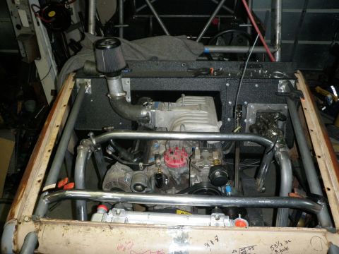 1961 International Scout 800 - Custom vehicle engine bay a roll cage and aftermarket air intake system.