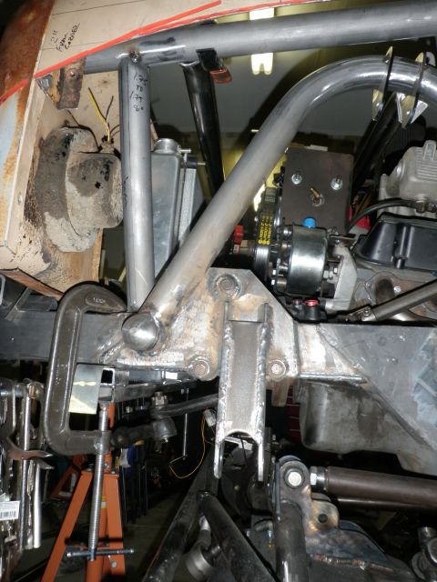 1961 International Scout 800 - Close-up view of a vehicle's engine bay, showing custom fabrication and suspension parts.