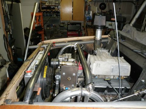 1961 International Scout 800 - Custom engine bay with roll cage and aftermarket components visible.