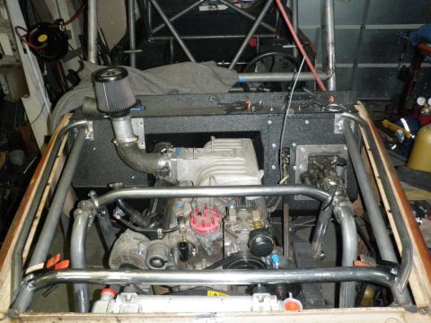 1961 International Scout 800 - Custom engine bay with roll cage structure visible, an aftermarket air intake system.
