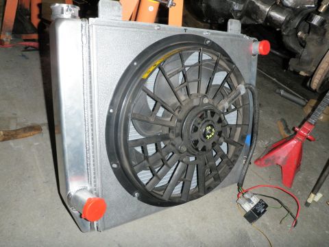 1961 International Scout 800 - Close-up of an aftermarket radiator and fan assembly, likely for a custom build or repair.