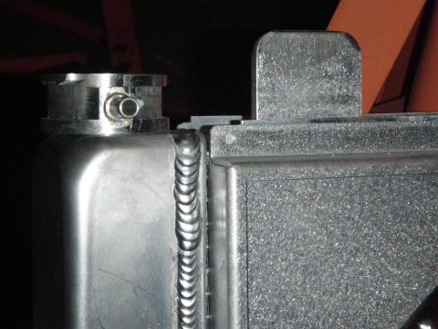 1961 International Scout 800 - Close-up view of an aluminum radiator's top section and cap.