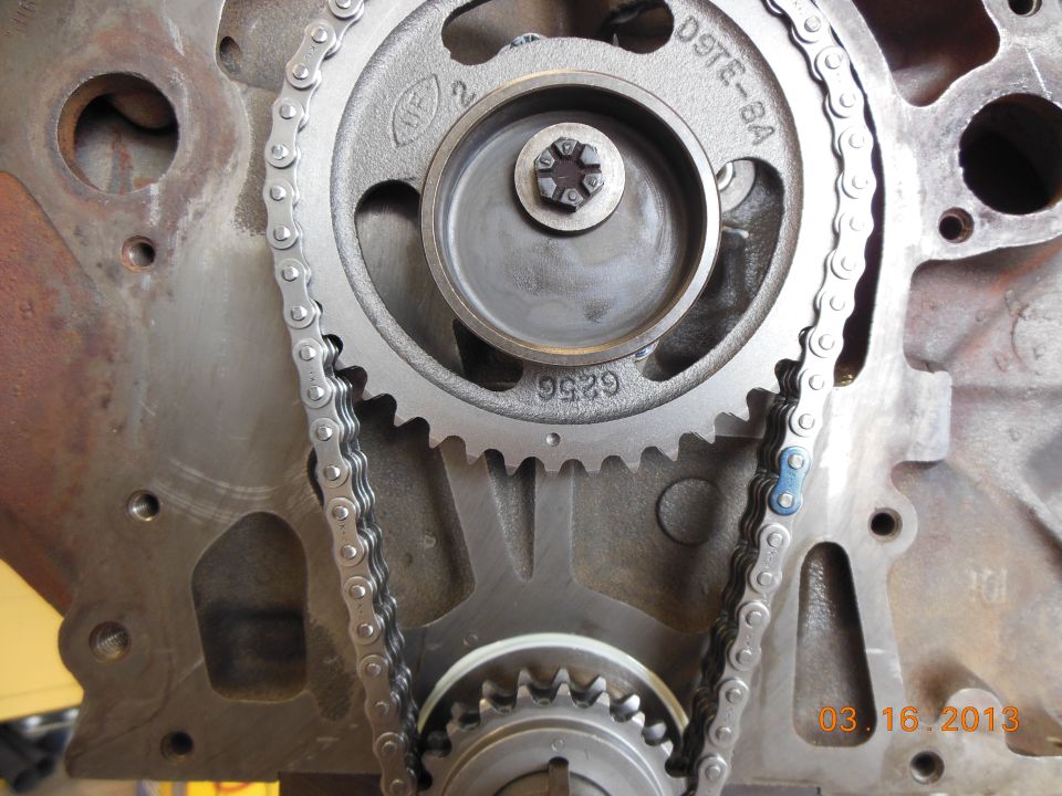 Engine timing chain and gears with part number D9TE-8A visible