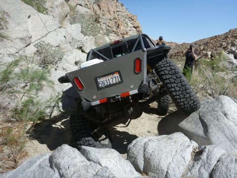1997 Ford Ranger - Modified 1997 Ford Ranger navigating a rocky trail with a custom rear bumper and roll cage.