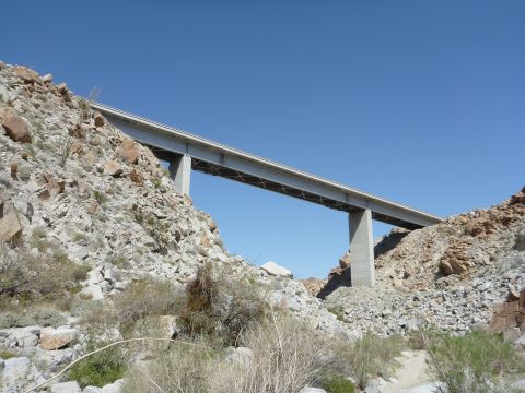 1997 Ford Ranger - A bridge spans a rocky canyon under a clear blue sky.