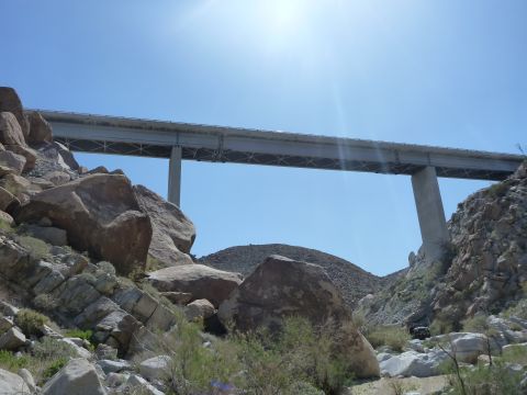 1997 Ford Ranger - A large concrete bridge crosses over a dry, rocky landscape with sparse vegetation.