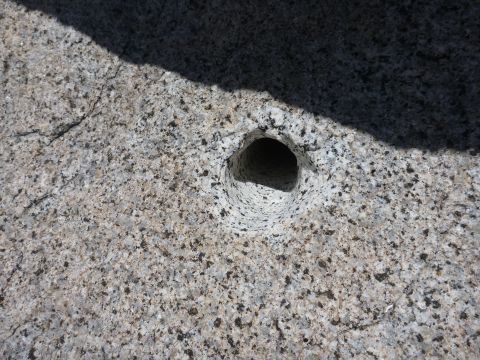 1997 Ford Ranger - A close-up view of a rock with a hole, showing texture and shadow.