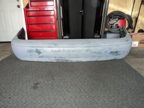 2004 Mercury Grand Marquis - This is a car bumper with the word MARAUDER embossed on it.
