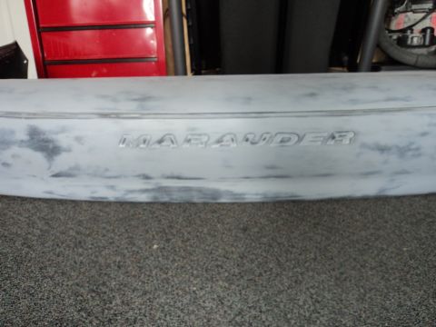 2004 Mercury Grand Marquis - The word 'Marauder' is visible on a car part that appears to be prepped for painting.