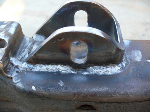 1976 Chevrolet Corvette - This is a close-up view of a welded metal bracket with two oval-shaped holes.