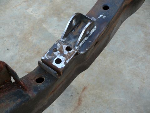1976 Chevrolet Corvette - A welded bracket is attached to a corroded frame rail, showing signs of modification.
