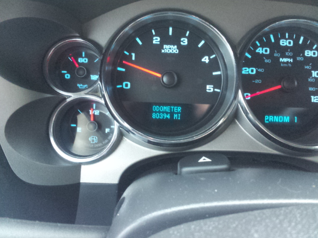 2008 GMC Sierra 3500 dashboard with odometer showing 80394 miles, tachometer, speedometer, fuel gauge, and oil pressure gauge