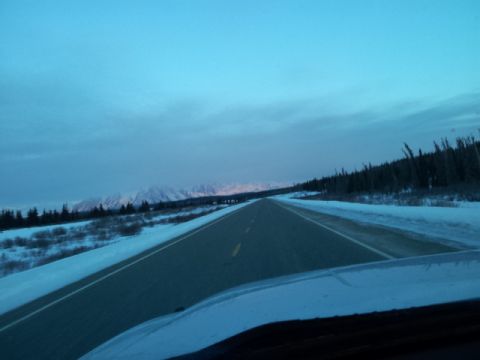 2008 GMC Sierra 3500 - Driving on a snowy road with mountains visible in the distance.