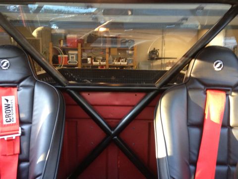 1996 Ford F-150 - Custom roll cage and racing seats installed in a truck's interior.