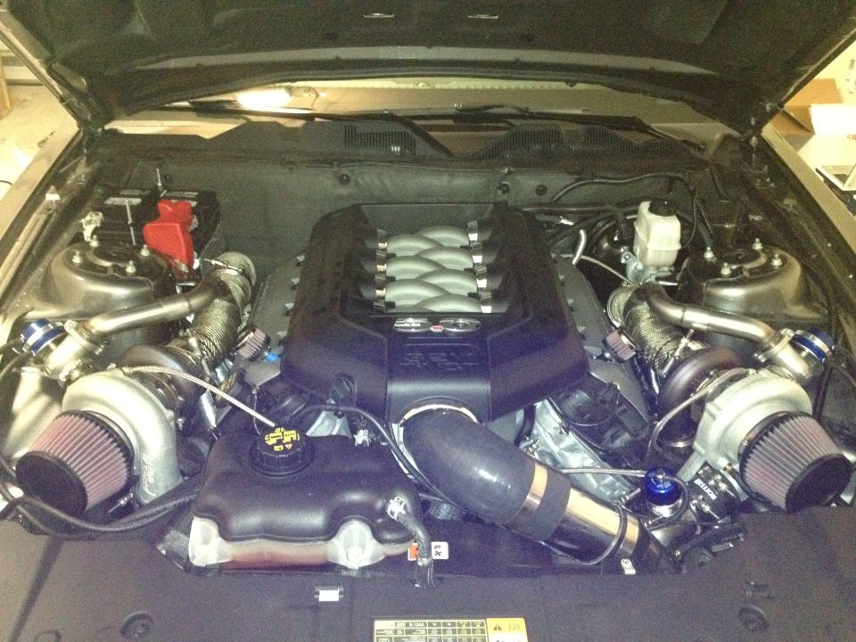 Twin-turbocharged V8 engine with custom intake and exhaust components, viewed from above