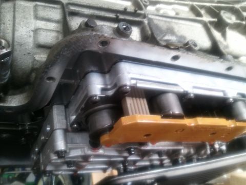 1994 Ford Bronco - This is a close-up view of a vehicle's transmission valve body, showing internal components.