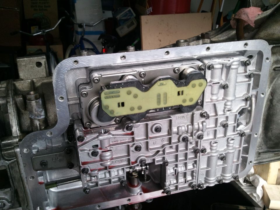 Automatic transmission valve body with yellow circuit board and metal casing