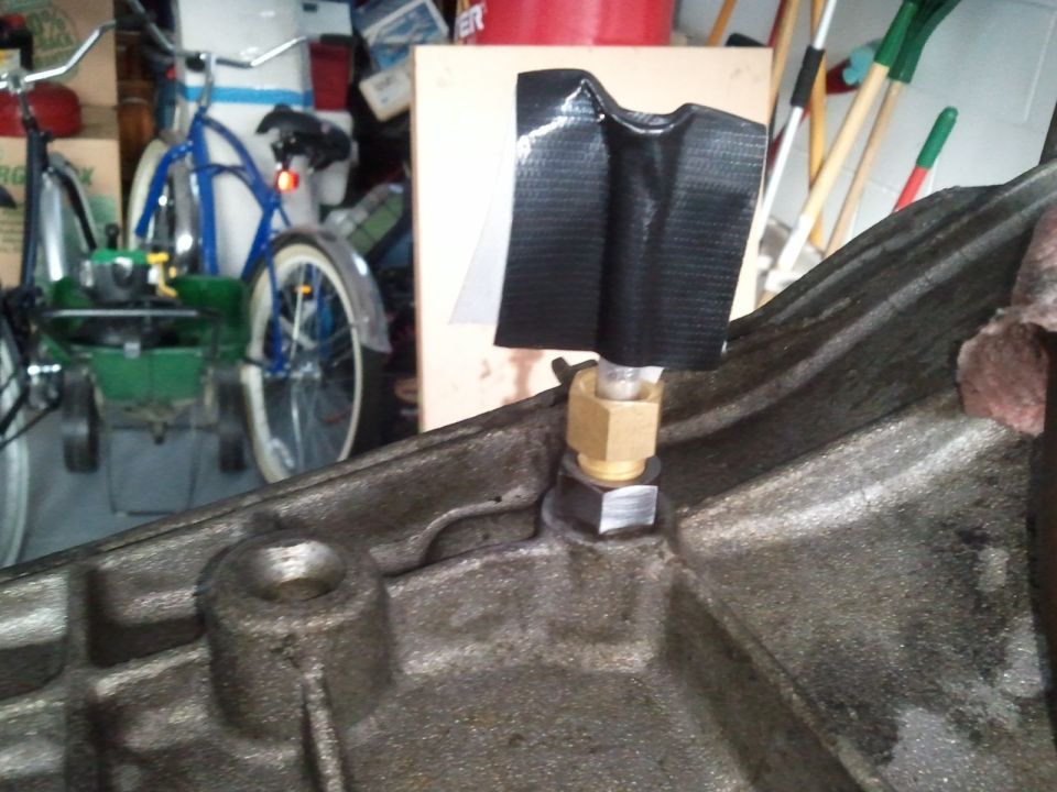 Transmission part with brass fitting and duct tape