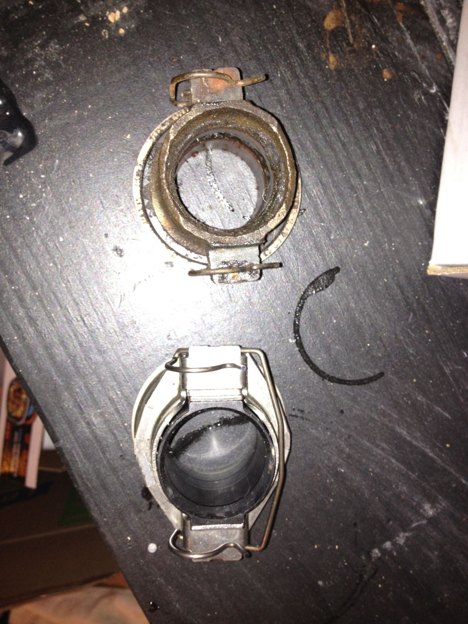 Clutch release bearing and fork assembly, one worn, one new