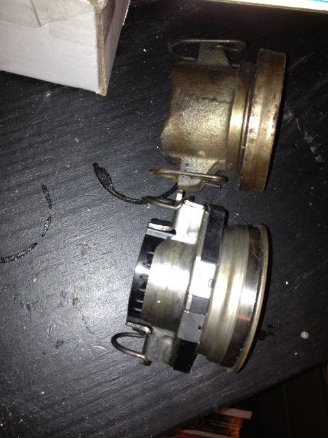 2005 Jeep Wrangler - Clutch slave cylinder and release bearing assembly shown on a dark surface.