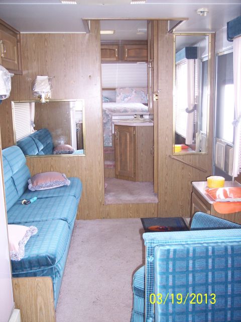 1973 Ford F-250 - Interior view of a recreational vehicle showing the living area and sleeping quarters.