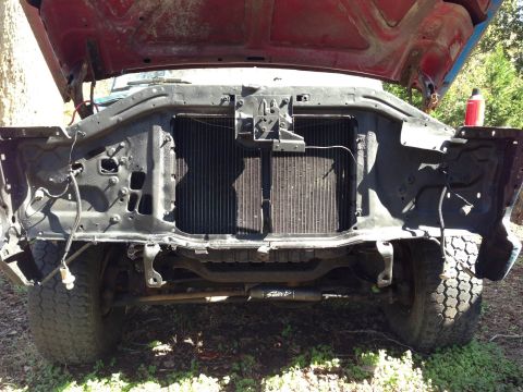 1979 Ford Bronco - Front view of a 1979 Ford Bronco with the hood up, showing the radiator and front end components.