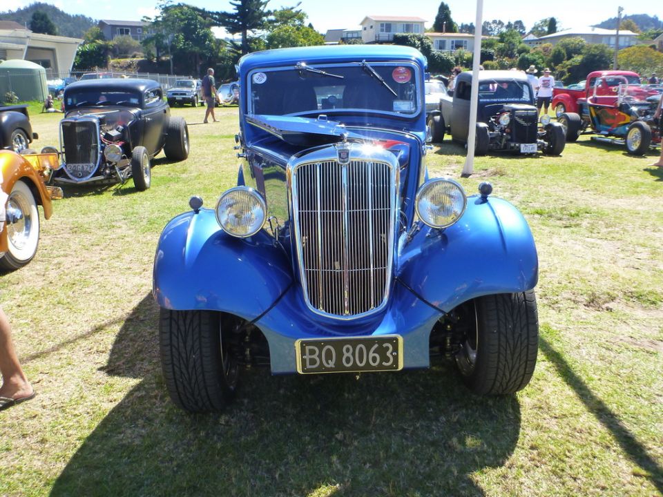 Blue hot rod with chrome grille and license plate BQ 8063