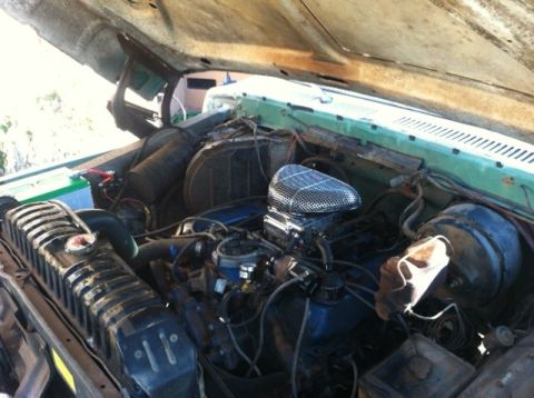 1977 Ford F-350 - Engine bay of a 1977 Ford F-350 truck, showing the V8 engine and radiator.