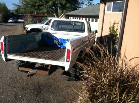1977 Ford F-350 - Rear view of a 1977 Ford F-350 pickup truck, with a second truck visible behind it.
