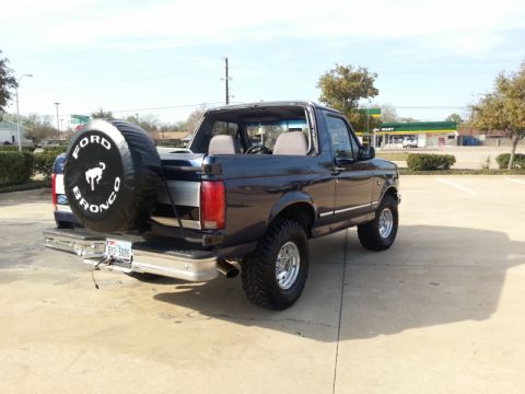 1995 Ford Bronco - This Ford Bronco is shown from the rear quarter angle, with its spare tire mounted externally.