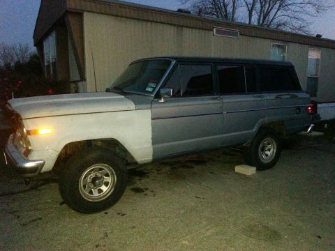1982 Jeep Wagoneer - This 1982 Jeep Wagoneer is parked outside a trailer home, with its front end in primer.