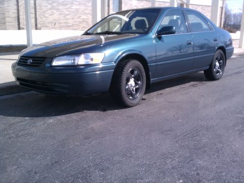 1998 Toyota Camry - Dark teal 1998 Toyota Camry sedan seen from the front-left angle.
