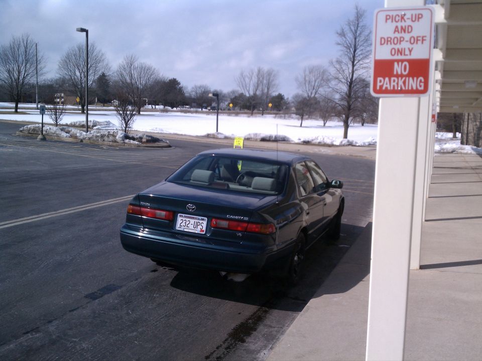 1998 Toyota Camry rear view, dark green sedan parked in a lot