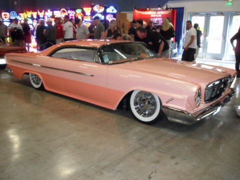 1973 Ford Ranchero - Custom 1959 Plymouth Belvedere with a two-tone paint scheme and lowered stance on display.