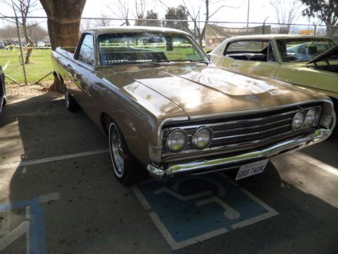 1973 Ford Ranchero - Front view of a 1970 Ford Ranchero with a distinctive grille, parked in a handicapped space.